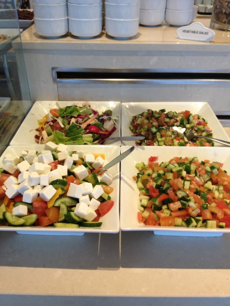 a group of plates of salads