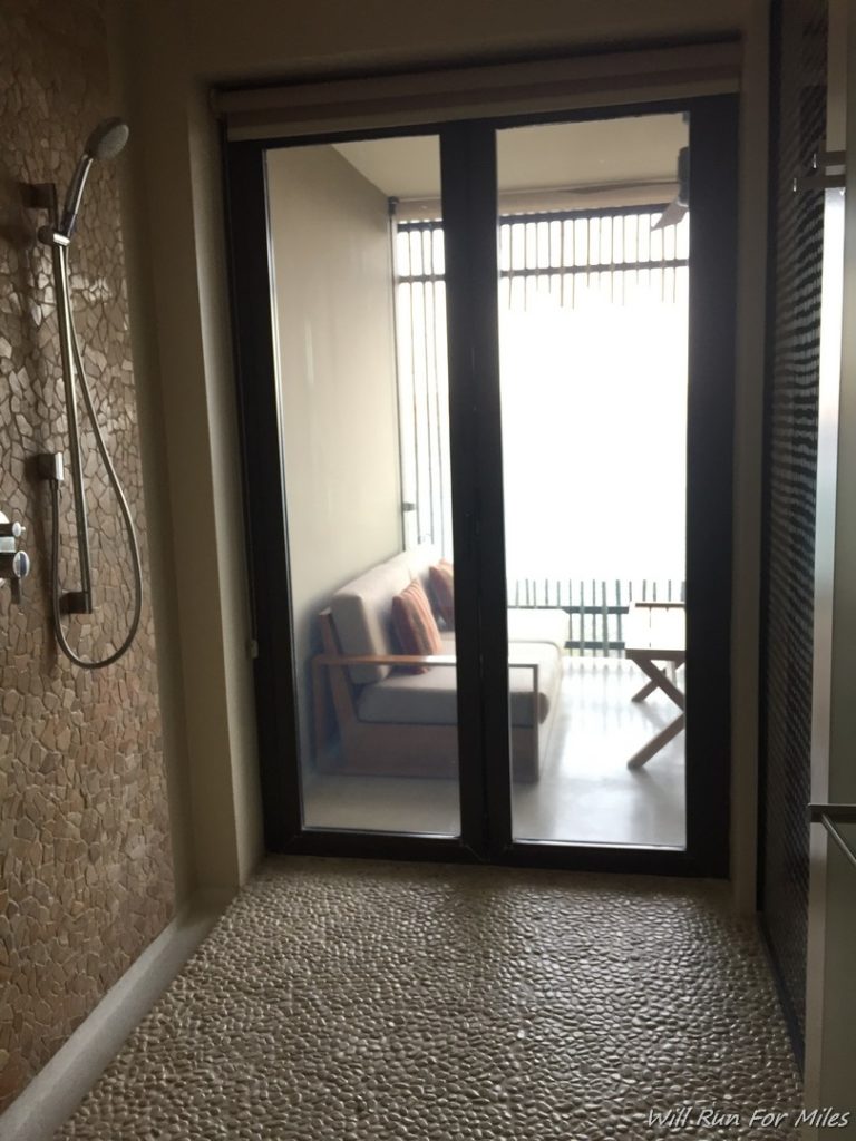 a glass door with a shower head