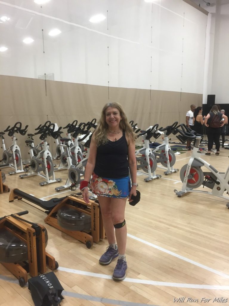 a woman standing in a gym