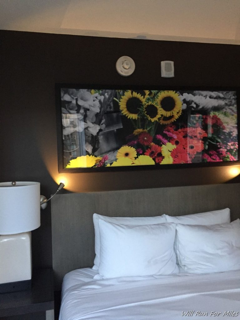 a picture above a bed