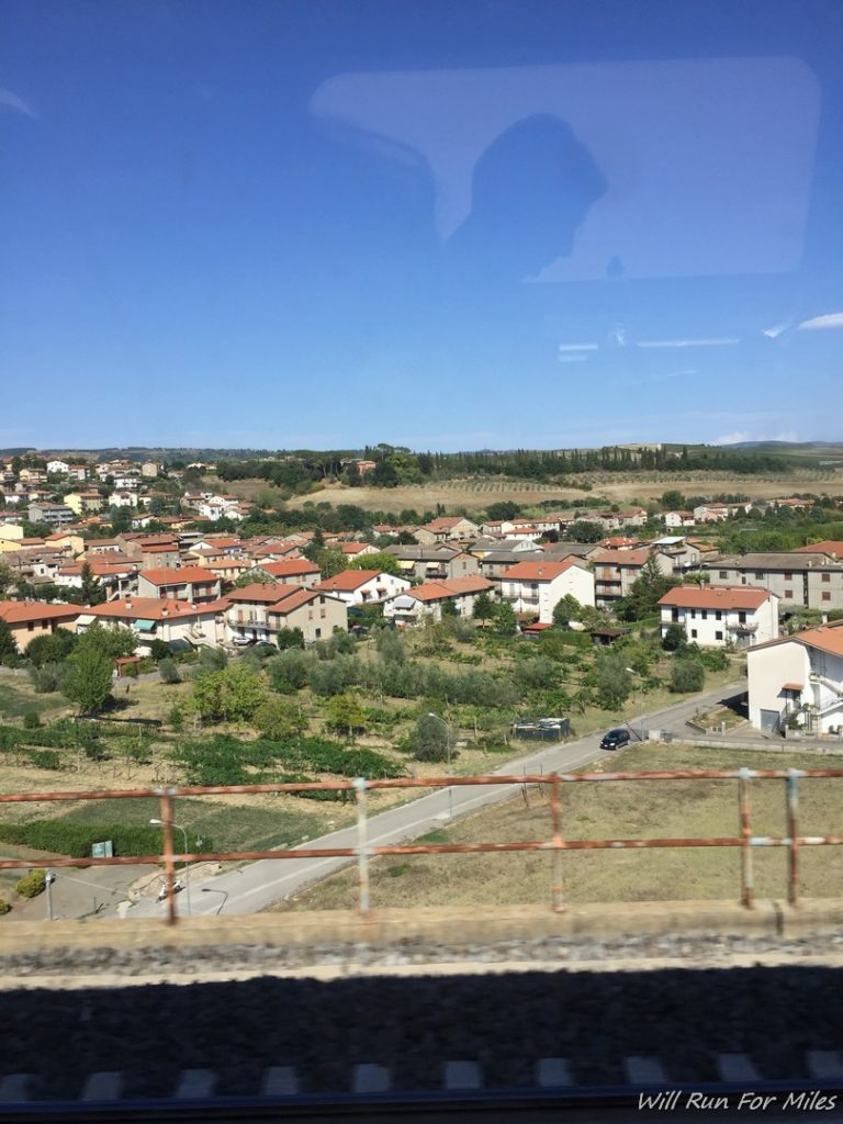 a view of a town from a train