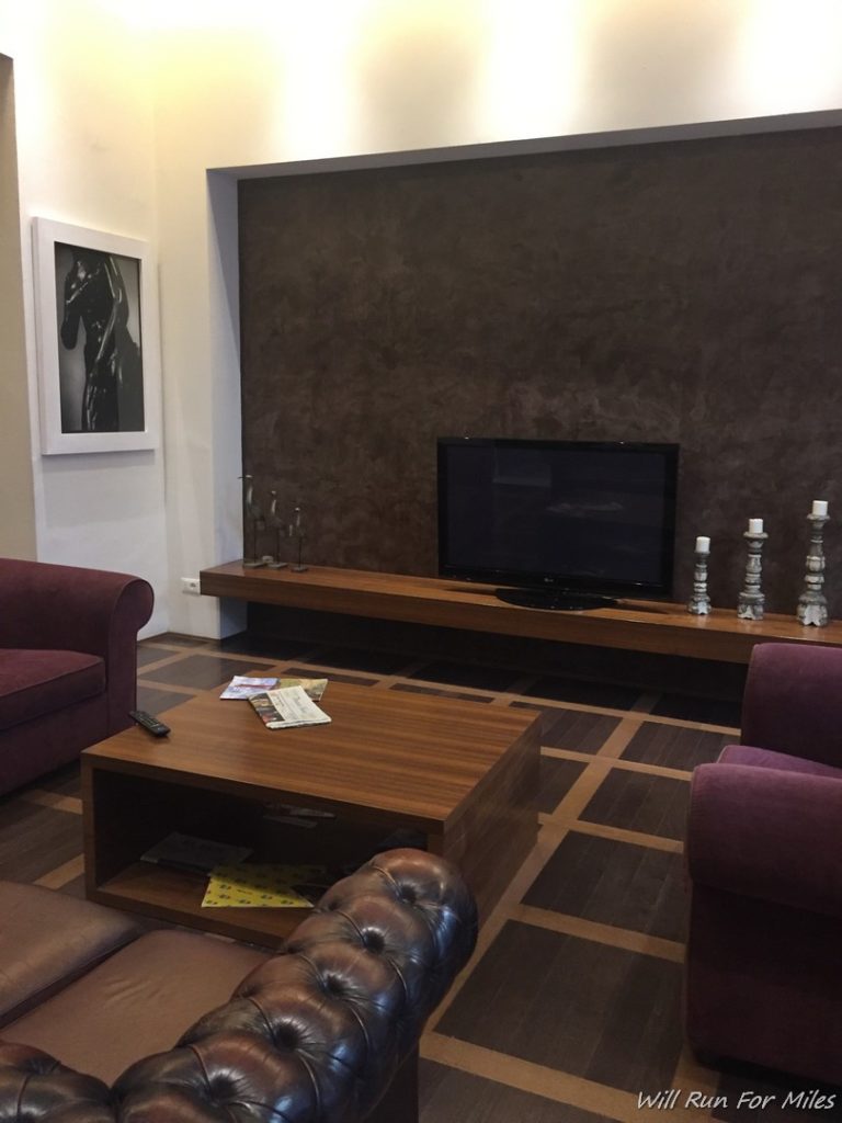 a living room with a television and a coffee table