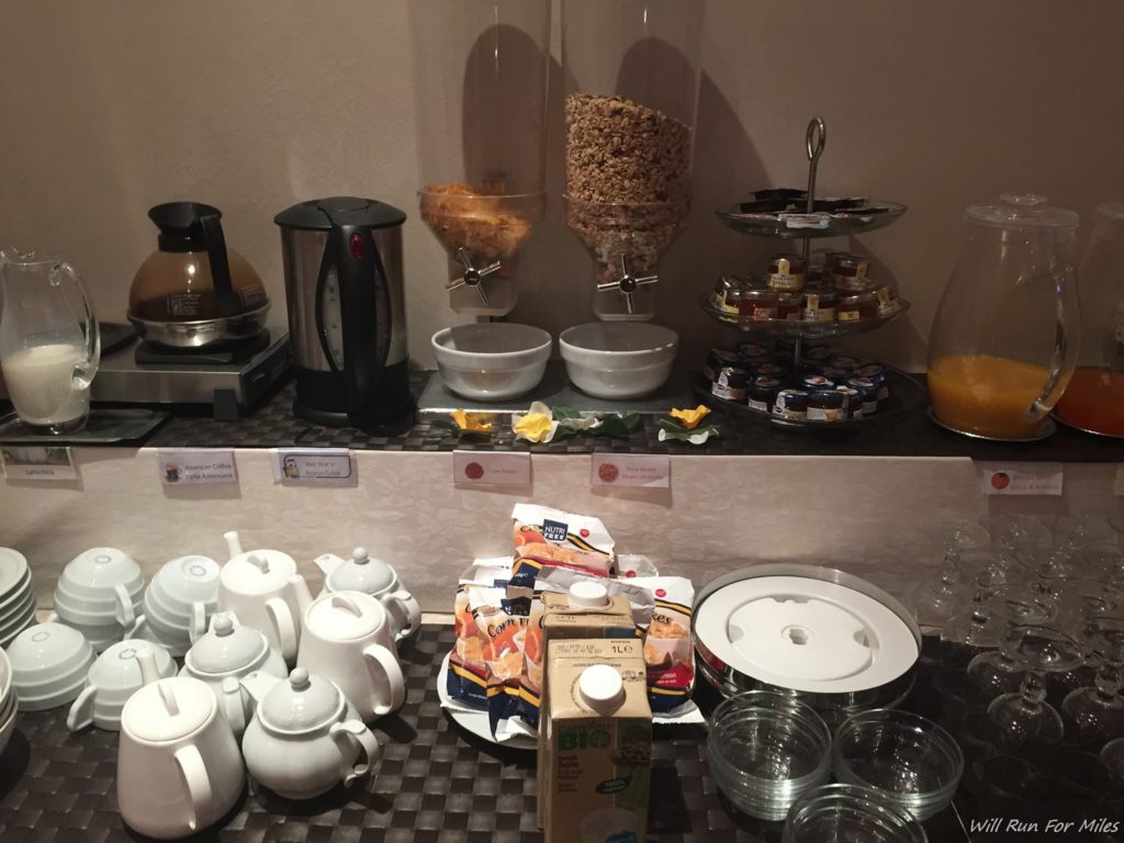 a breakfast buffet with a variety of food items