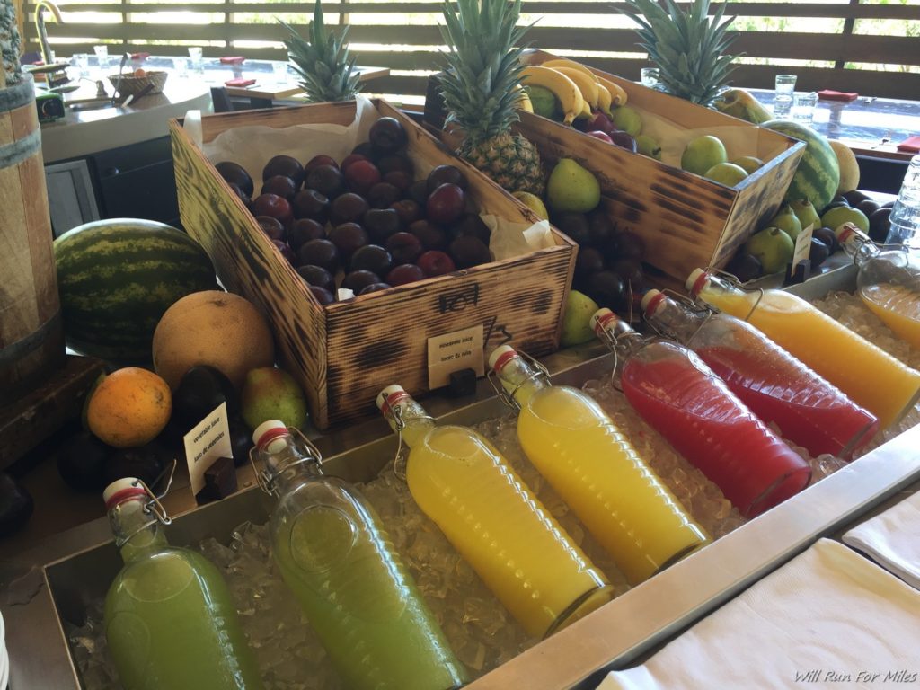 a group of fruit and juices on a table