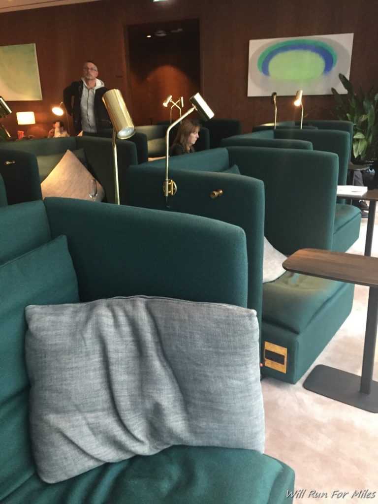 a group of green couches in a room