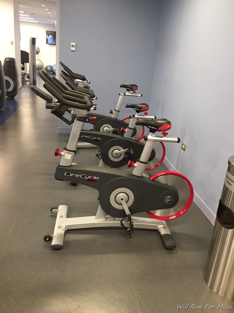 a group of exercise bikes in a room