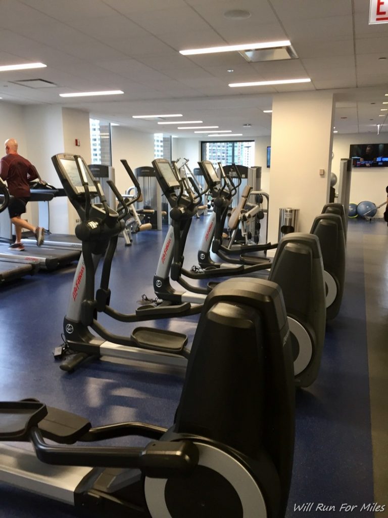 a group of treadmills in a gym