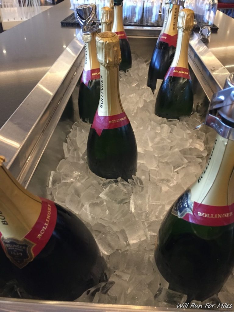 bottles of champagne in ice in a cooler