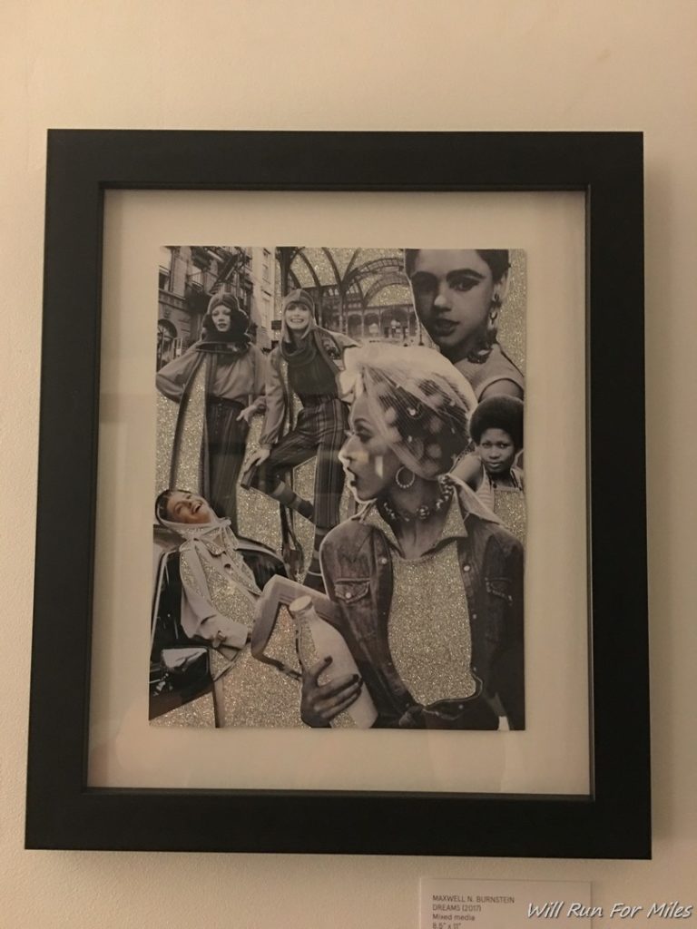 a framed picture of women in a black frame