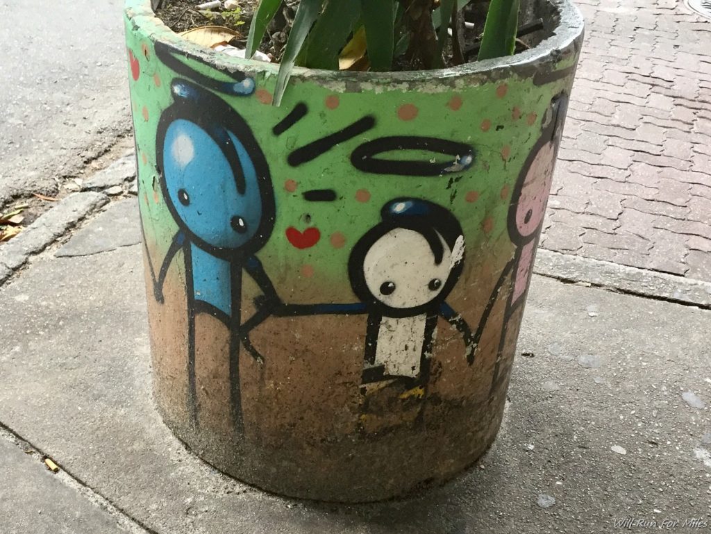 a planter with graffiti on it