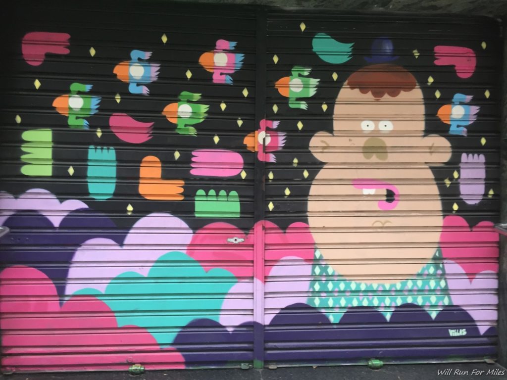 a wall with a cartoon character painted on it