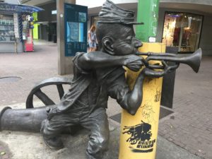 a statue of a man holding a gun