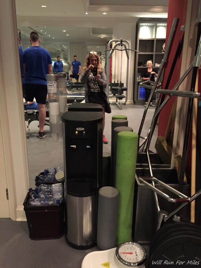 a woman taking a selfie in a gym