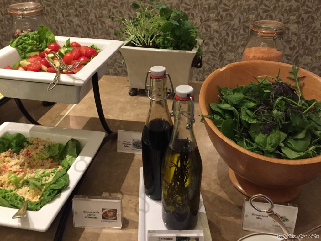 a salad and a bottle of oil