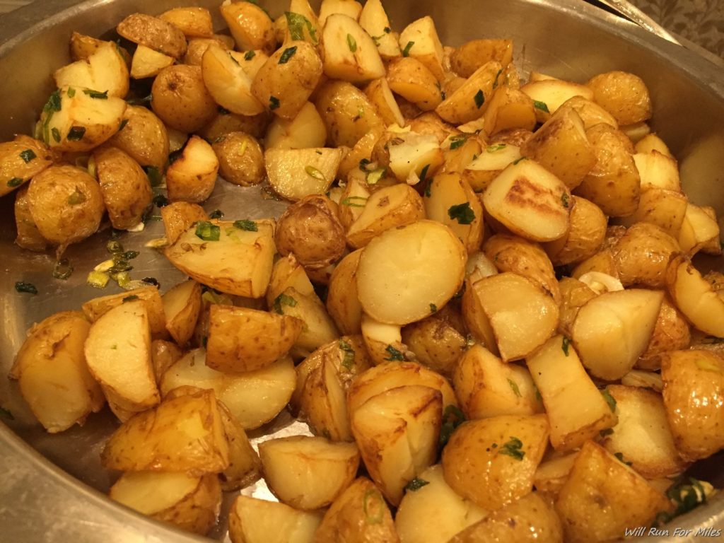 a pan of potatoes with herbs