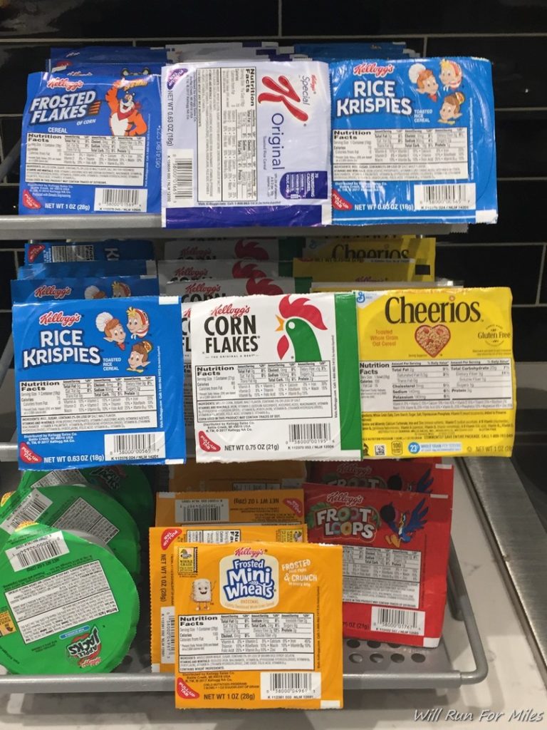 a shelf with packages of cereal