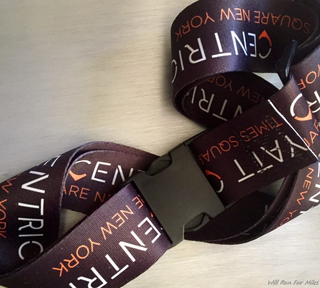 a brown and white lanyard with white text