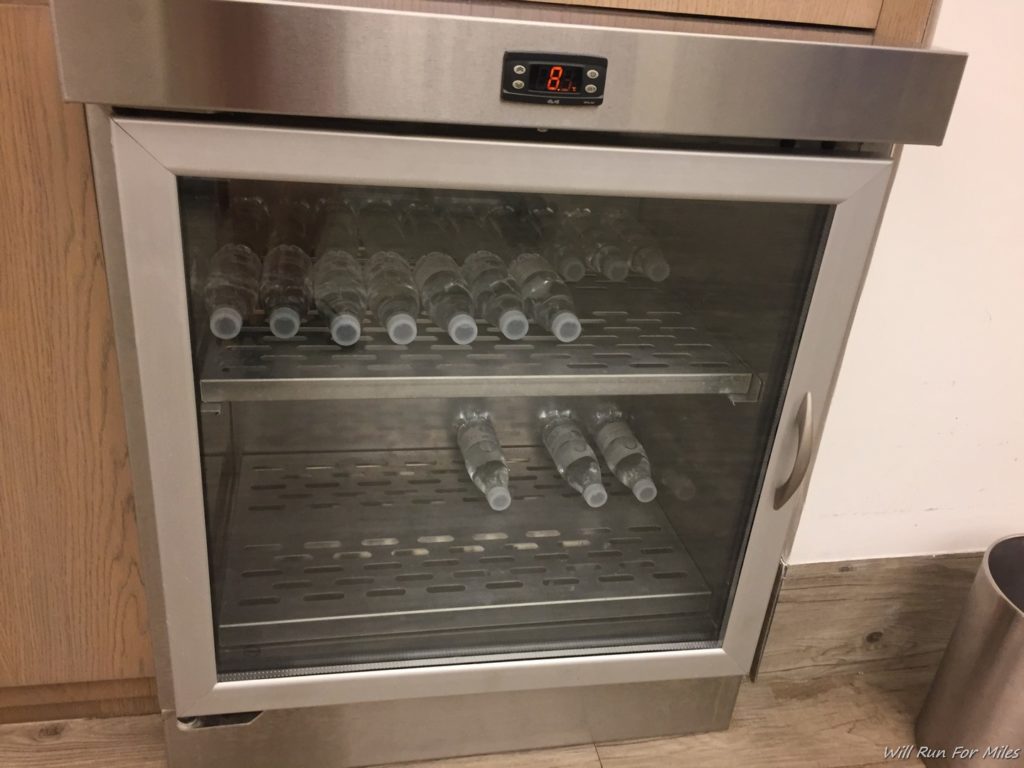 a refrigerator with bottles in it