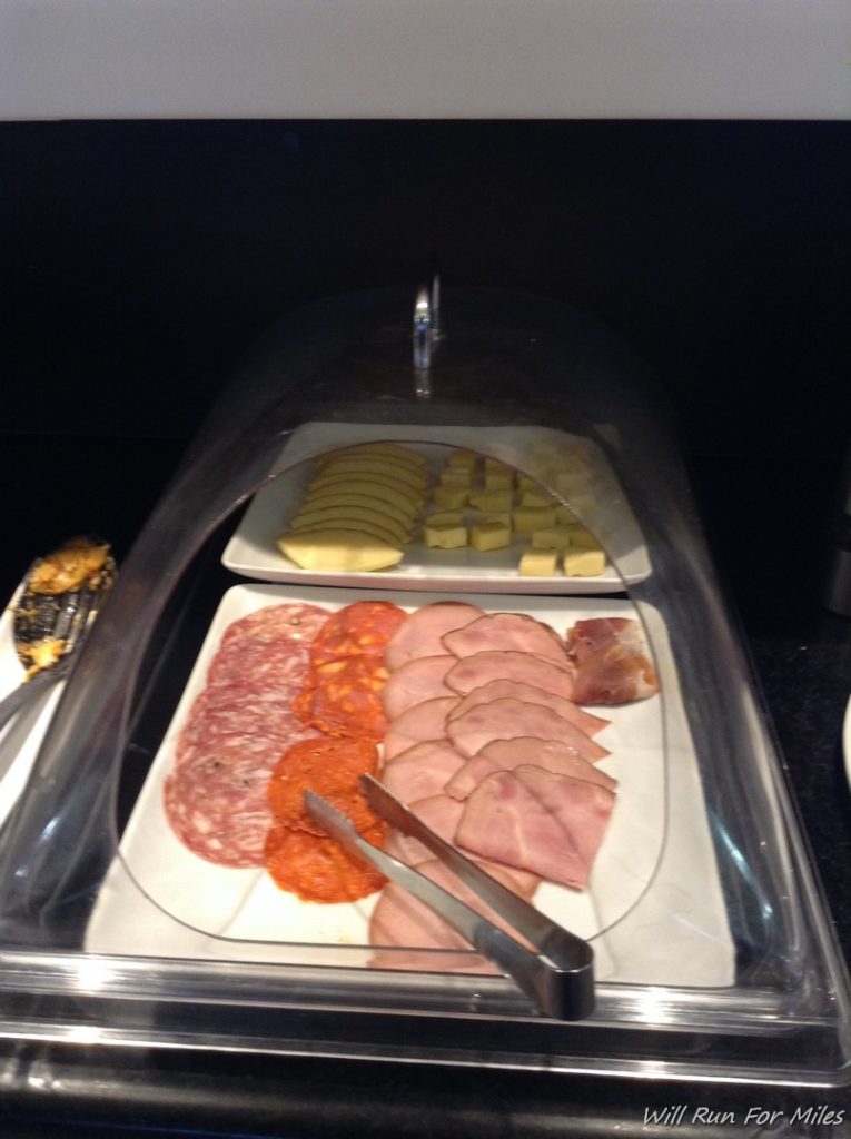 a tray of food with a glass cover