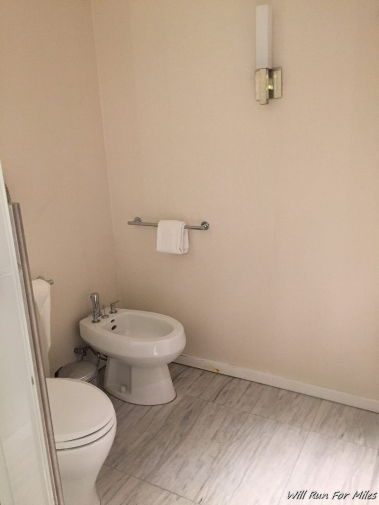 a toilet and bidet in a bathroom