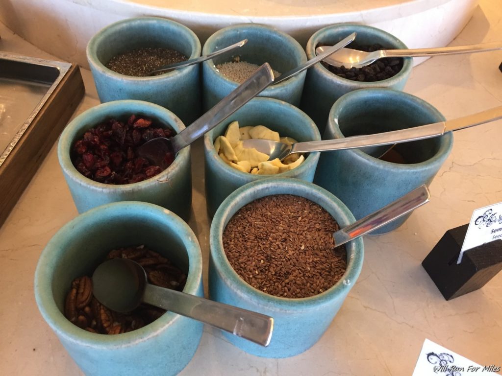 a group of blue containers with spoons in them