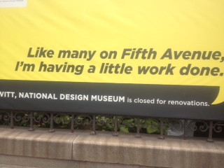 a yellow sign with black text