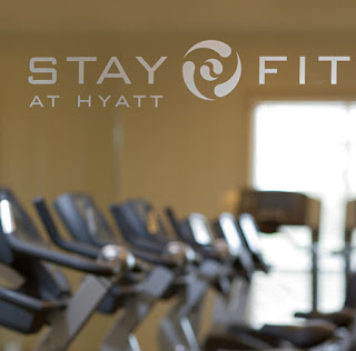 a group of exercise machines in a gym