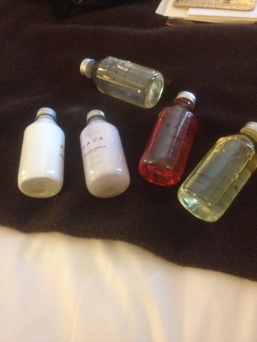 a group of small bottles on a brown surface