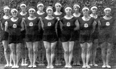 a group of women wearing matching outfits