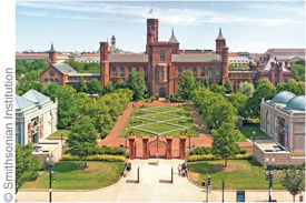 a large brick building with a garden with Smithsonian Institution in the background