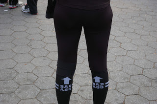 a person wearing black pants with white arrows on them