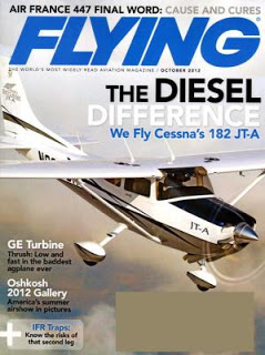 a magazine cover with a plane in the air