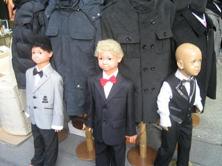 a group of mannequins in suits