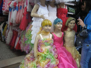 mannequins in dresses in a store