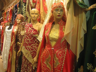 a group of mannequins in different dresses