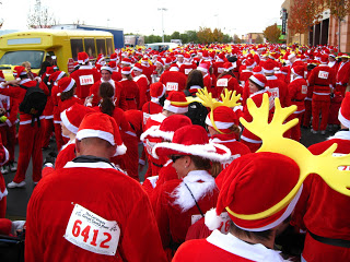 a crowd of people wearing santa outfits