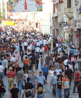 a crowd of people walking on a street