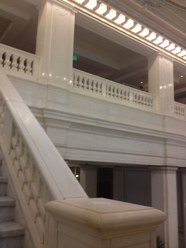 a white staircase with a railing