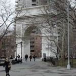 a large stone arch with a building under it