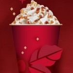 a red cup with whipped cream and brown specks
