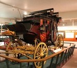 a horse carriage in a museum