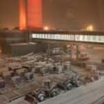 a large building with many trucks in the snow
