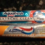 two tubes of toothpaste on a marbled surface