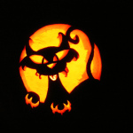 a pumpkin carving of a cat