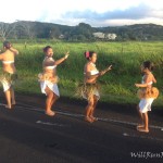 a group of women dancing on a road