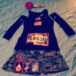 a black shirt and a skirt with patches on it