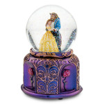a snow globe with a couple of people inside