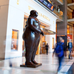 a statue of a woman in a mall