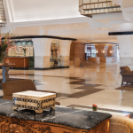 a lobby with a marble floor and a marble table