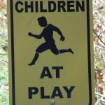 a sign with a picture of a boy running